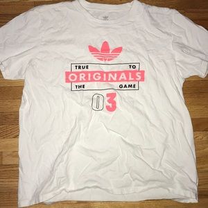 White and pink adidas t shirt.